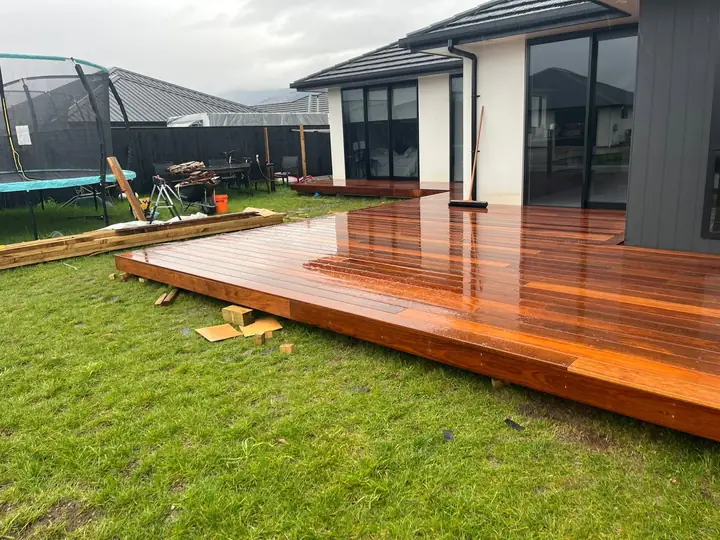 Hardwood deck wrapping around a new house