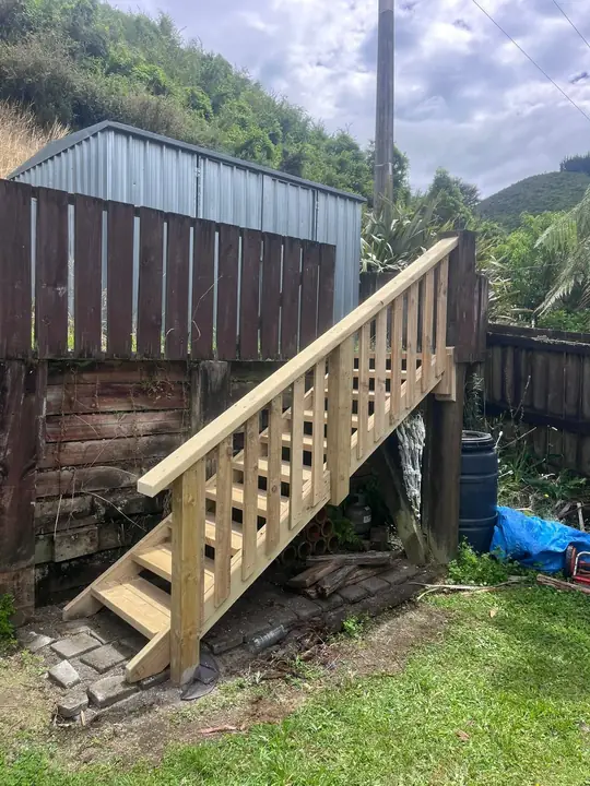 New timber stairs up to a raised yard