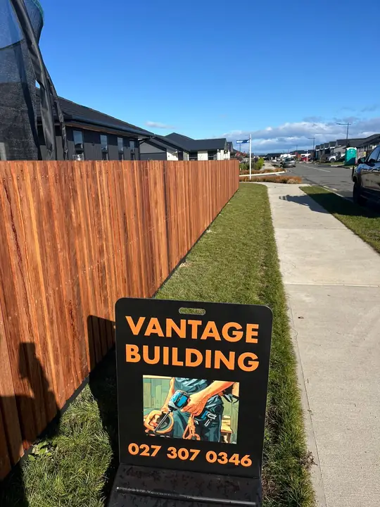 New timber fence with Vantage Building job sign