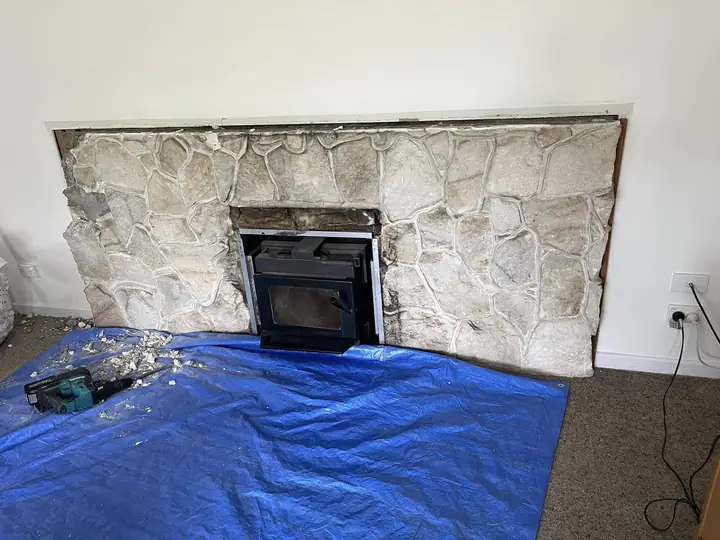 Fireplace before, old stone surround