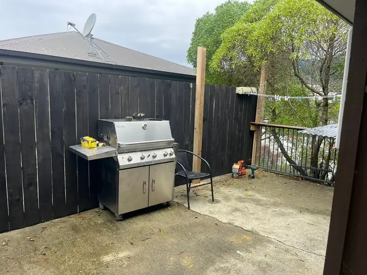BBQ area with black fence