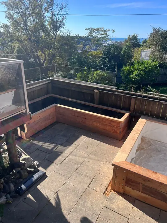 Timber planter boxes around a patio